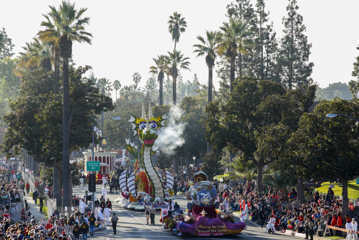 The Shriners Hospitals for Children "Caring for Kids Around the World," The UPS Store, Inc. "Books Bring Dreams to Life" and The Forum "50th Anniversary of the Forum" floats move along the route during 129th Rose Parade in Pasadena.