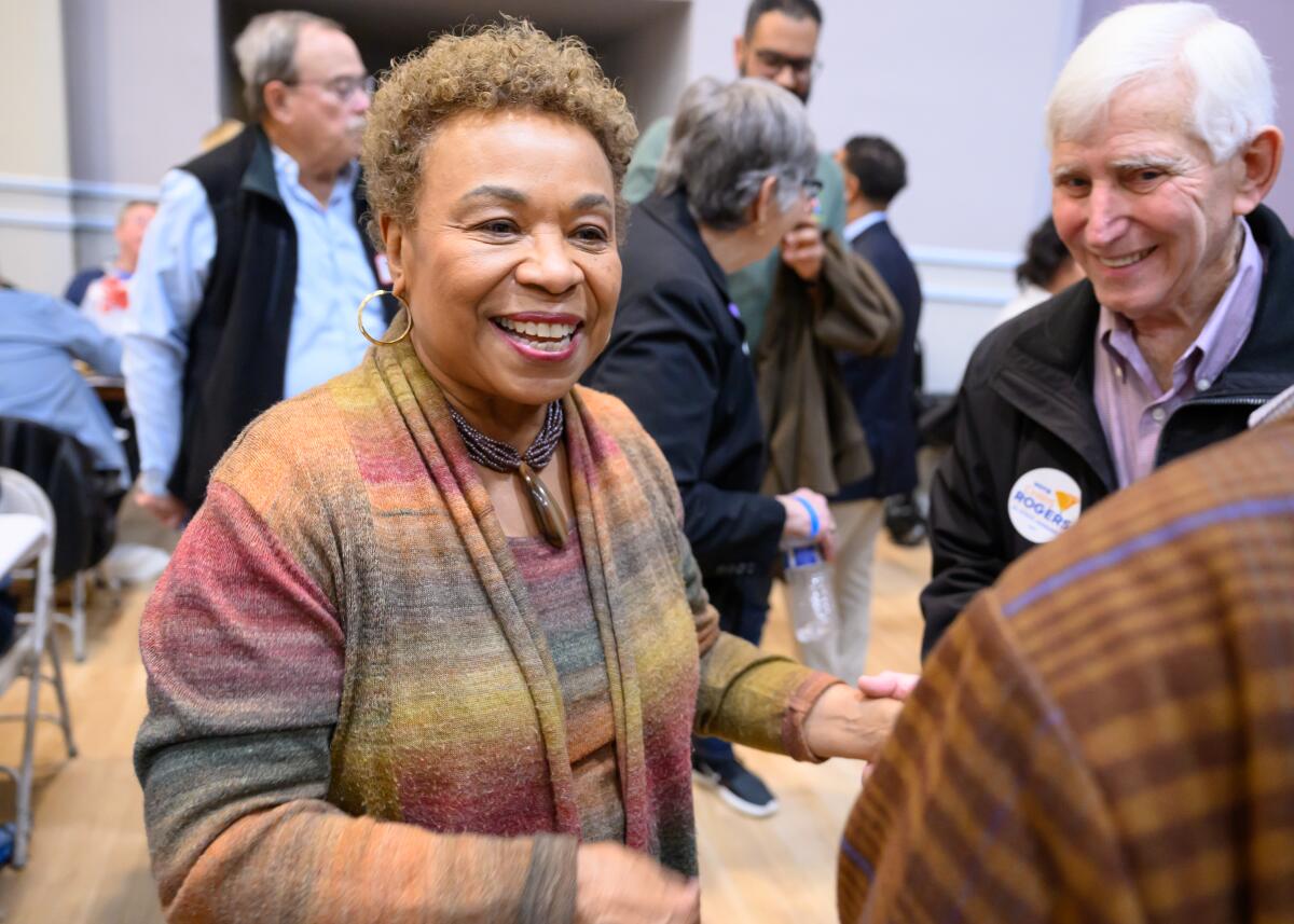 Rep. Barbara Lee mingling with people at an event 