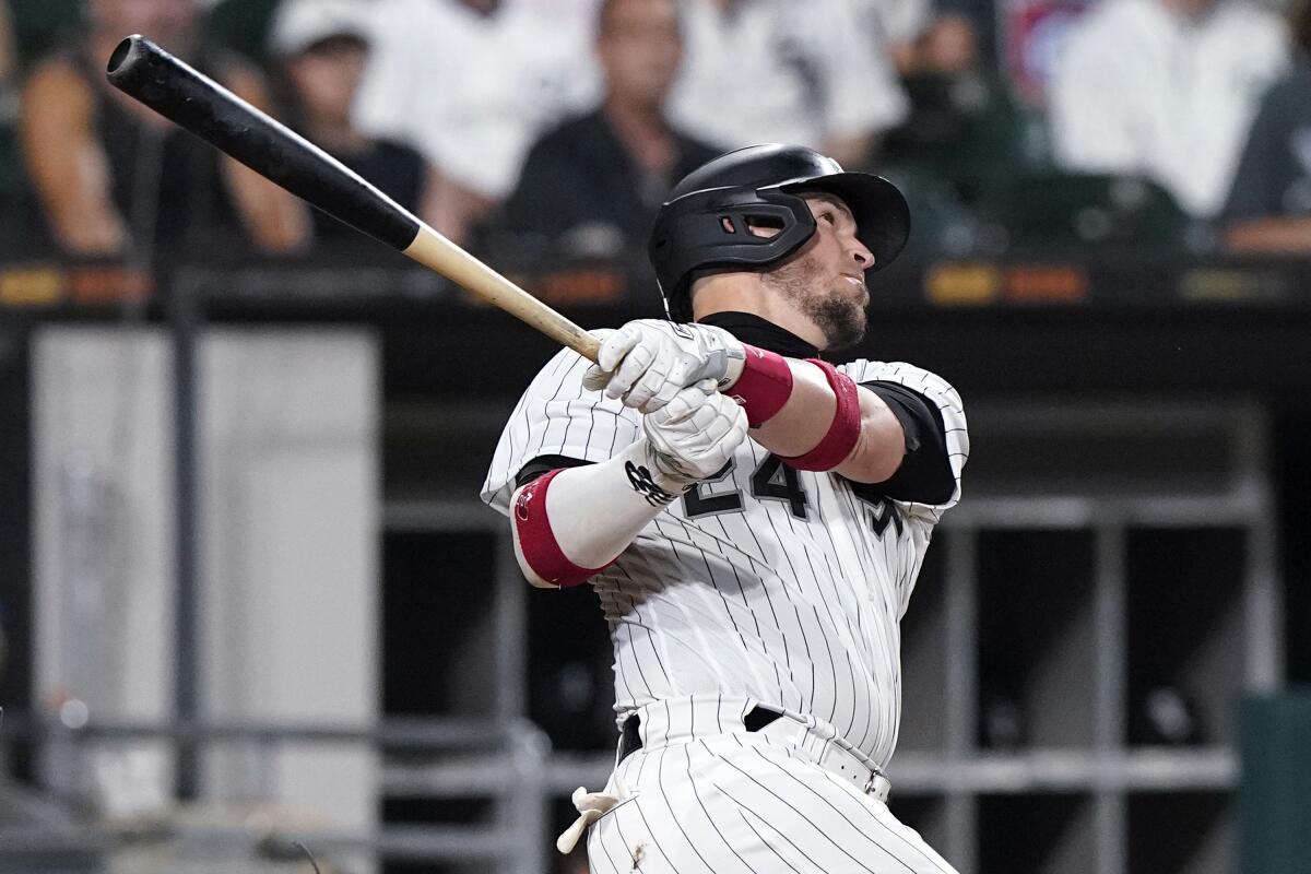 Chicago White Sox's Yasmani Grandal hits a three-run home run during the fifth inning of a baseball game against the Minnesota Twins in Chicago, Wednesday, June 30, 2021. (AP Photo/Nam Y. Huh)