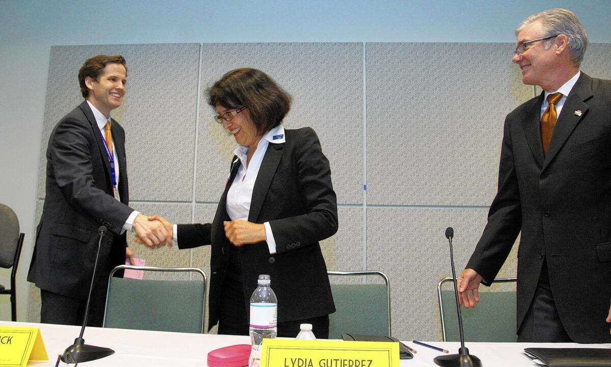 State superintendent candidate Marshall Tuck shakes hands with opponent Lydia Gutierrez and incumbent Tom Torlakson following a candidates forum in Los Angeles. Each of the candidates represents vastly different views on how to improve student achievement.