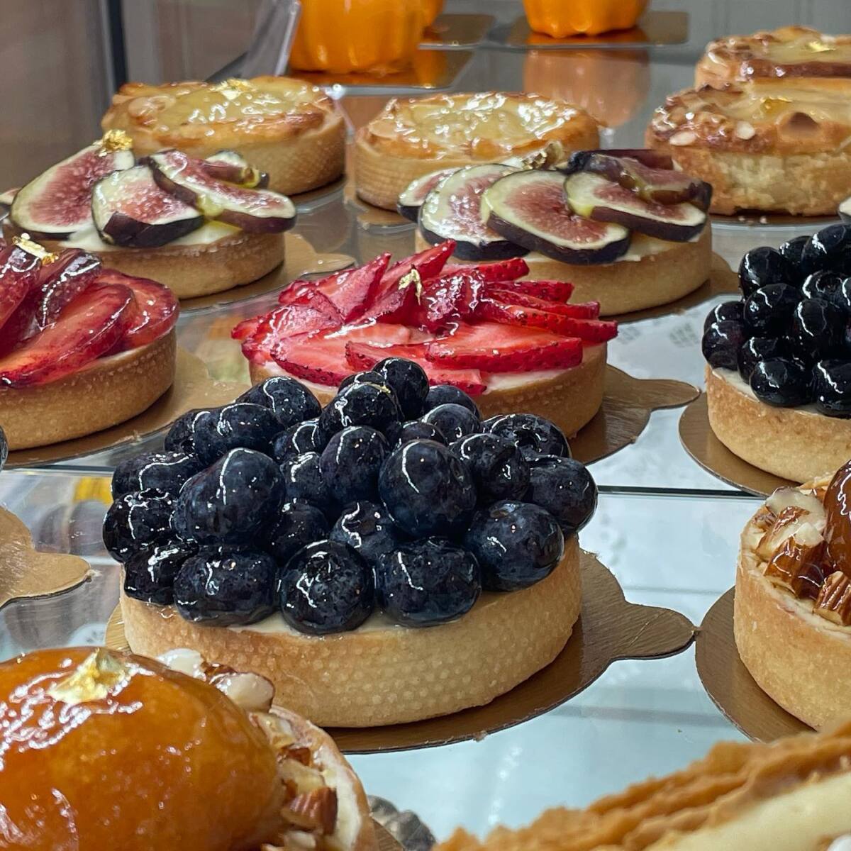 A variety of fruit-topped desserts at Parisien Gourmandises in La Jolla.
