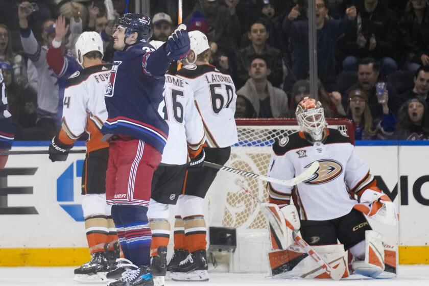 New York Rangers' Chris Kreider, front left, reacts after scoring on Anaheim Ducks.