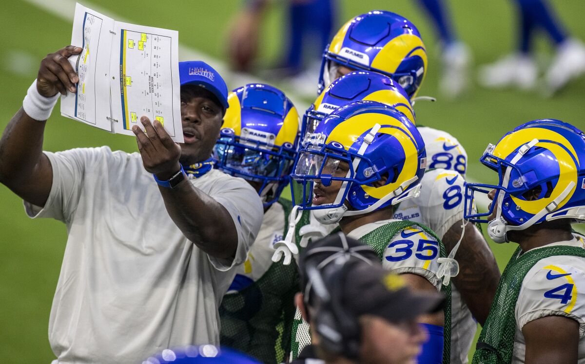 Rams assistant special teams coach Tory Woodbury with players before a scrimmage at SoFi Stadium.
