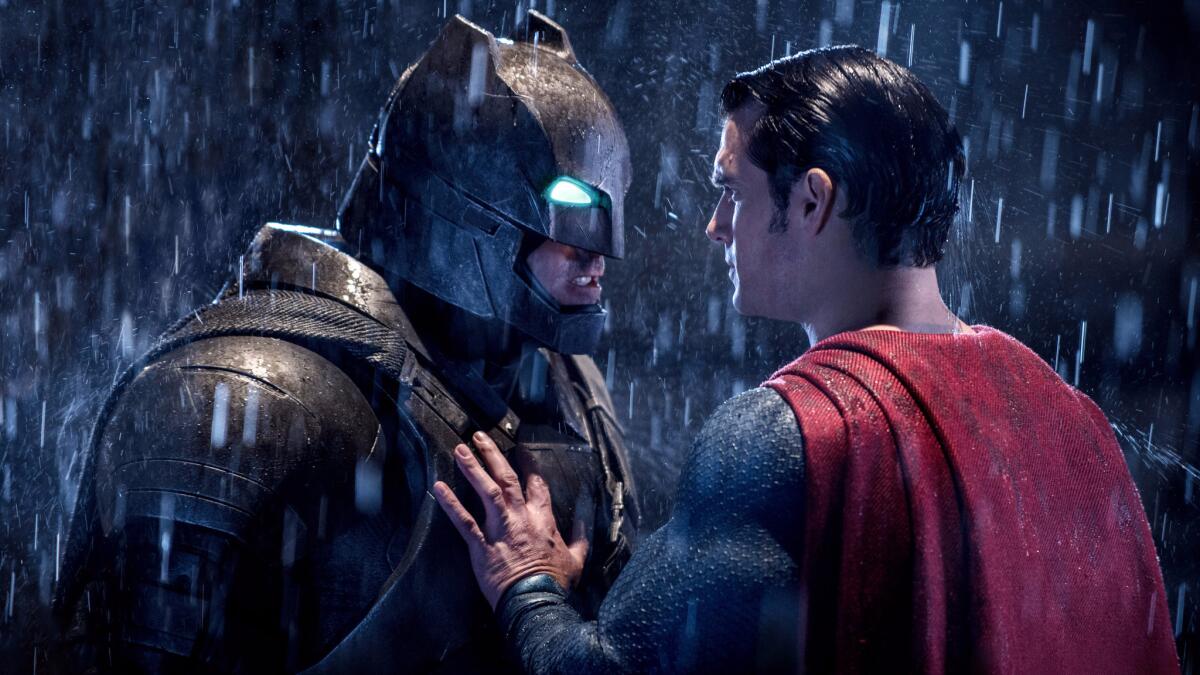 Batman and Superman in the rain