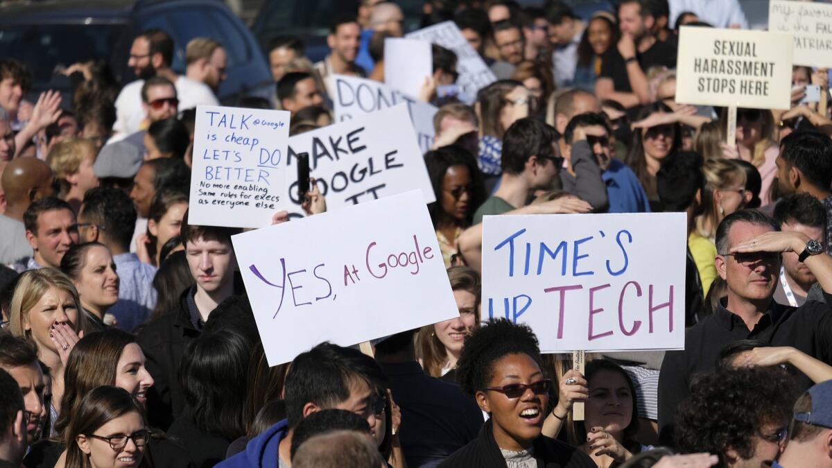 Google workers in San Francisco hold up signs during a Nov. 1 walkout. A wave of activism among workers has made tech companies confront and, in some cases, change their policies on mandatory arbitration.