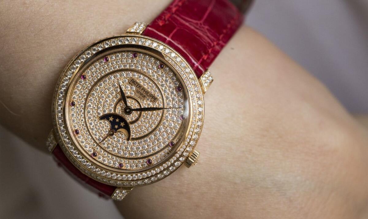 A rose-gold women's watch from Patek Philippe's Complications collection.