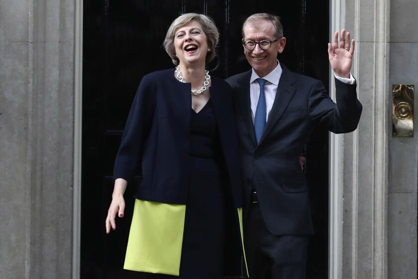 British Prime Minister Theresa May and husband Philip May outside 10 Downing Street.