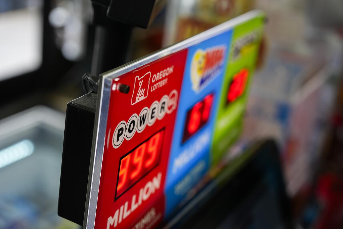 A sign for the Powerball jackpot is displayed at a 7-Eleven