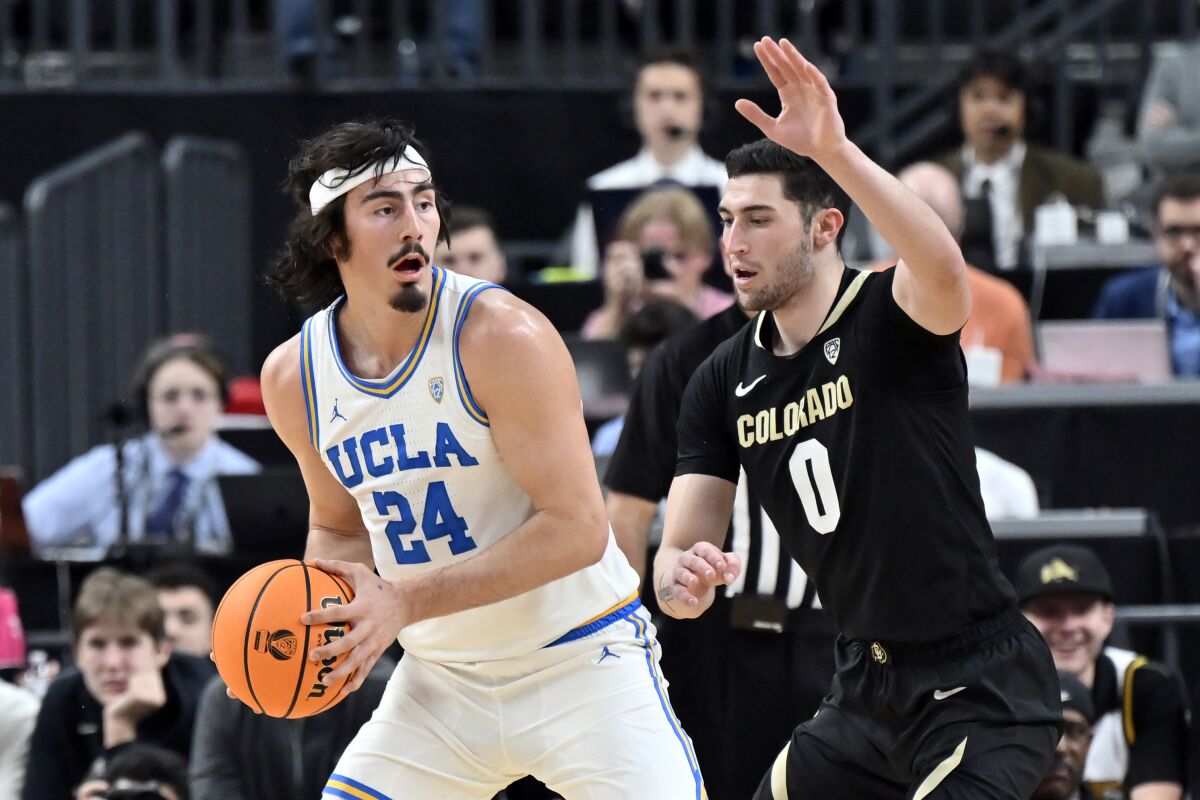 UCLA guard Jaime Jaquez Jr. looks to pass against Colorado guard Luke O'Brien.