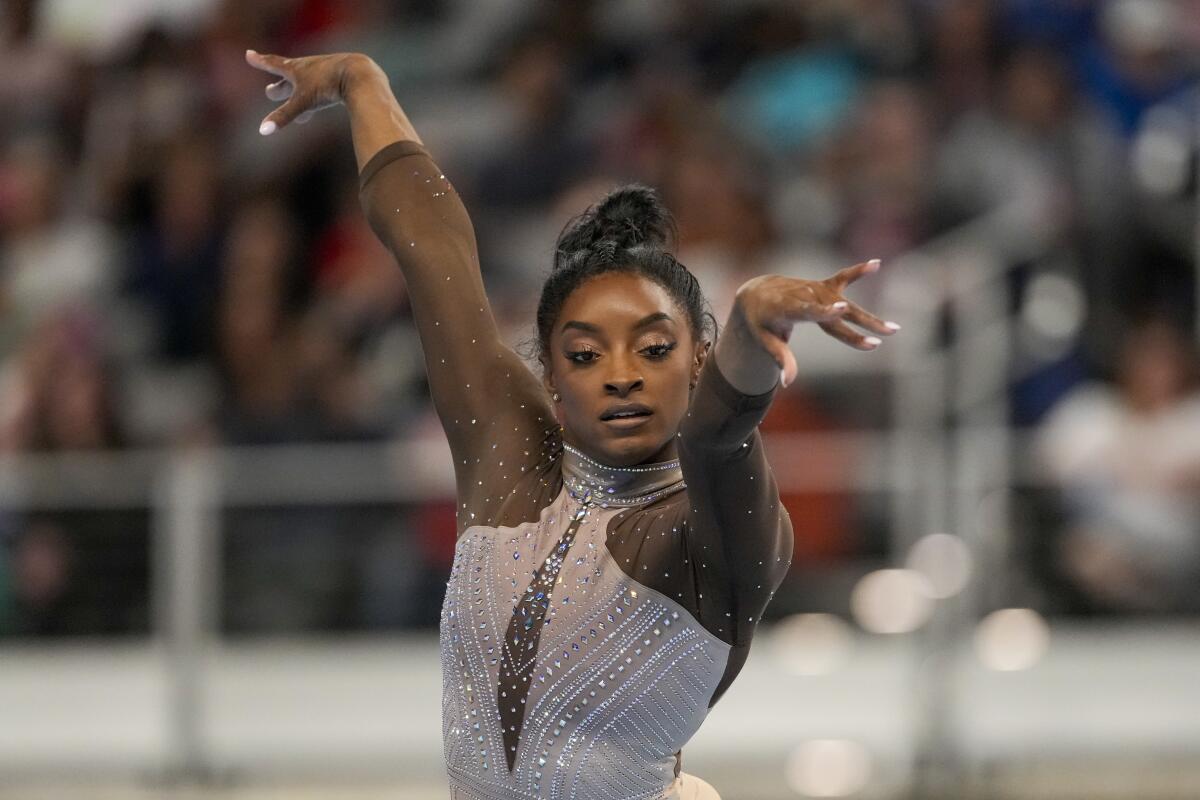Simone Biles strikes a pose as she performs floor exercises during the U.S. gymnastics championships on Sunday.