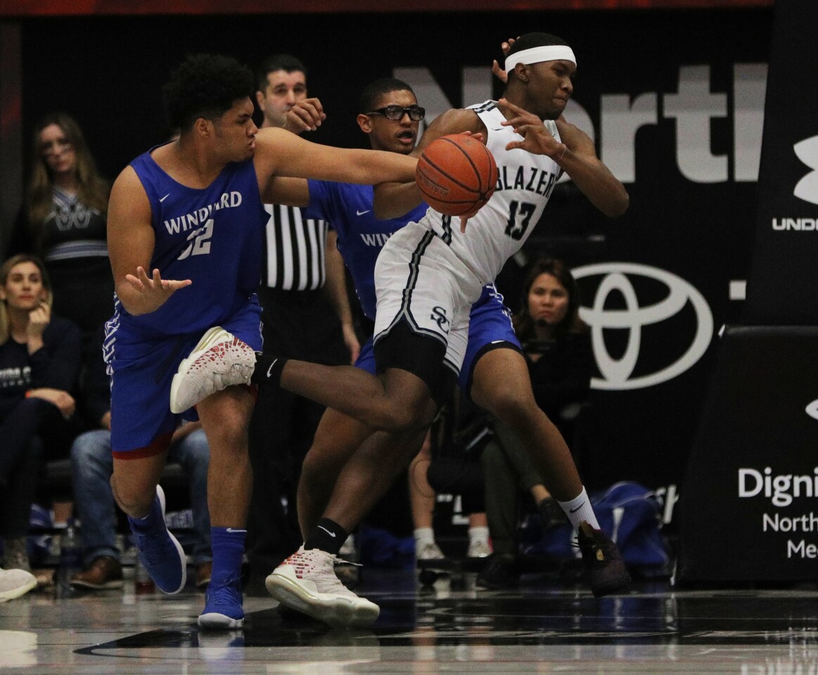 NORTHRIDGE, CA - JANUARY 23, 2020: Sierra Canyon forward Shy Odom (13) loses the ball as he is double-teamed by Windward forward Marcus Joseph (32) and Windward forward Brandon Richard (21) at Cal State Northridge on January 23, 2020 in Northridge, California. (Gina Ferazzi/Los AngelesTimes)