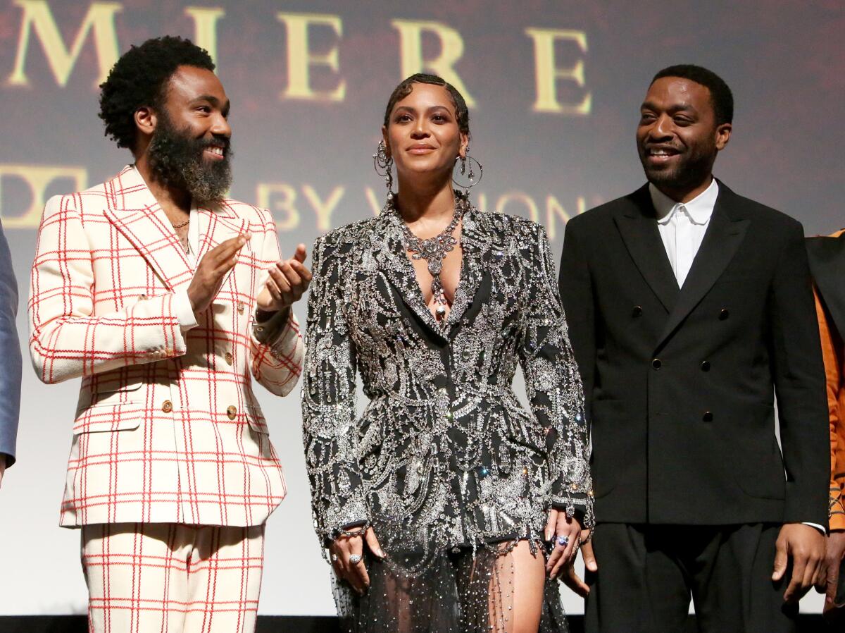 Donald Glover, left, Beyoncé Knowles-Carter and Chiwetel Ejiofor appear on stage before the screening of "Lion King."