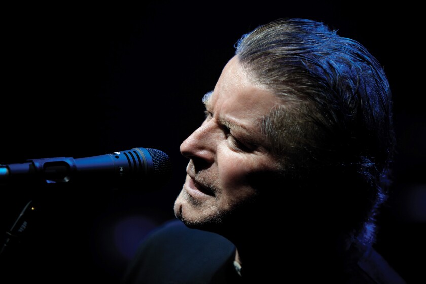 Close-up of a man singing into a microphone