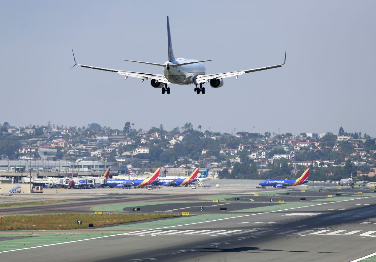A United Airlines jet approaches San Diego International Airport for a landing after flying in from New York.