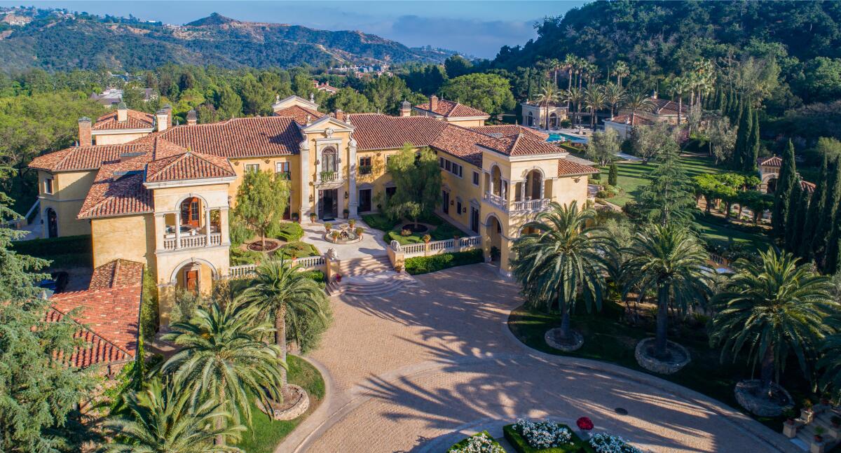 Built in 1998, the estate combines three lots across nearly 10 acres and centers on an Italian-inspired mansion.