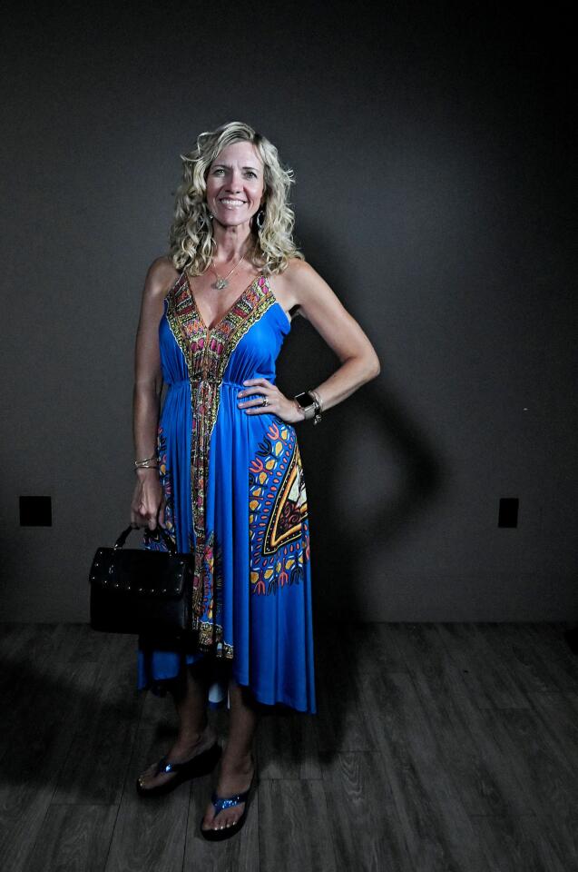 Who: Alison Bucklin, 42, Canton resident, SERVPRO of Hunt Valley/Lutherville commercial sales and marketing representative/Arbonne International independent brand ambassador Spotted at: LinkedInLocal Baltimore networking event at The Cove at Citron What she wore: Multi-color print high-low dress from venus.com; Colin Stuart turquoise glitter wedge flip-flops from victoriassecret.com; collected charms hung on a chain; Chloe + Isabel turquoise and clear rhinestone drop earrings from a home jewelry party; and studded black handbag she’s had for years. She always wears hair tinsel: “I love sparkles. Let your light shine.”