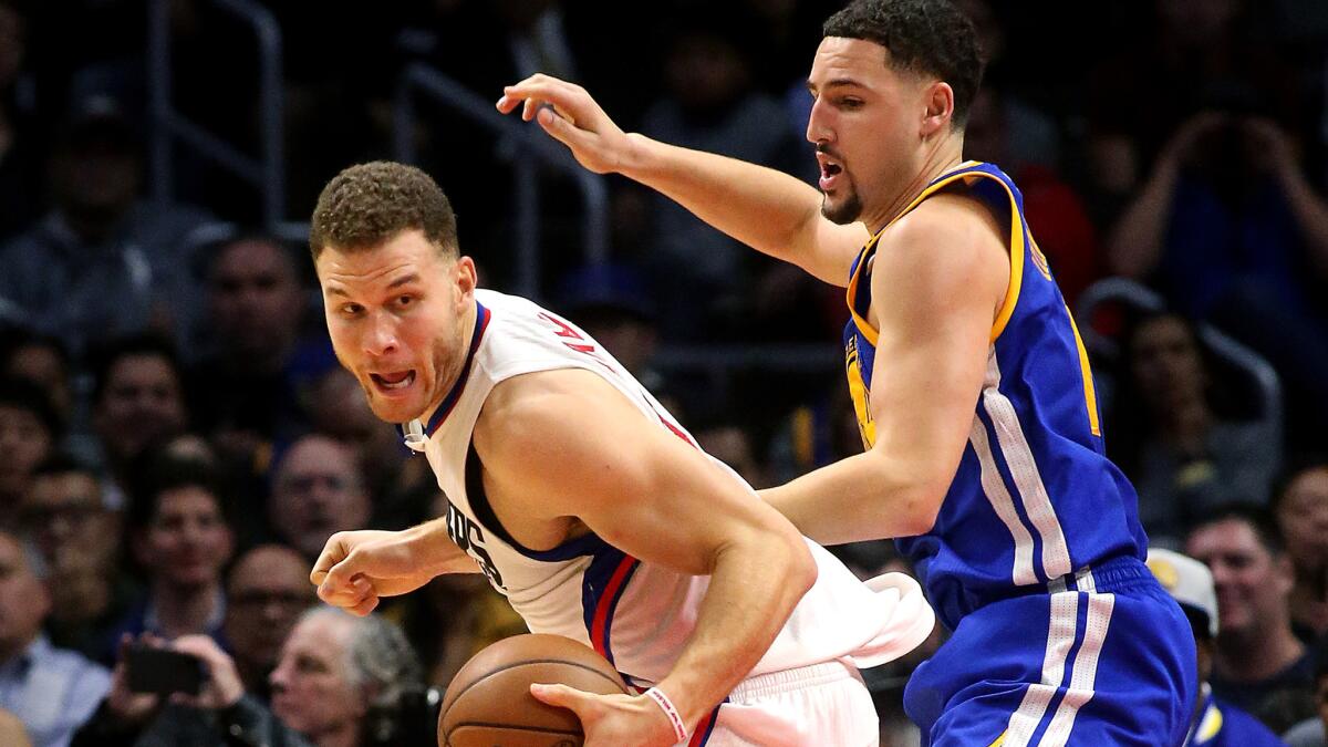 Clippers forward Blake Griffin works in the post against Warriors guard Klay Thompson during a Dec. 7 game at Staples Center.