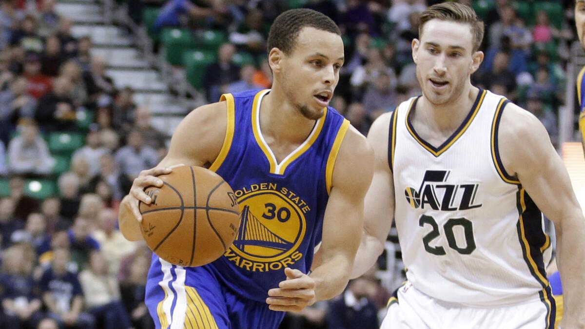 Golden State Warriors guard Stephen Curry drives around Utah Jazz forward Gordon Hayward during a game on Jan. 30.