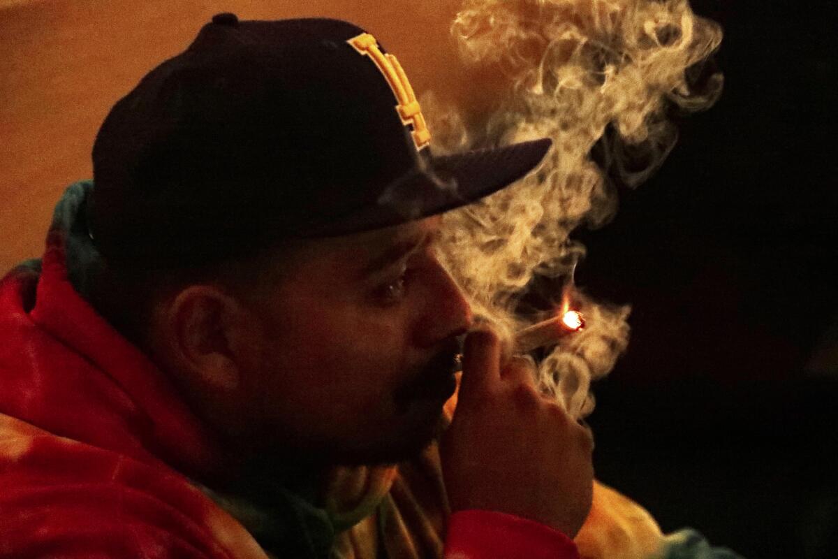 A man smokes a joint