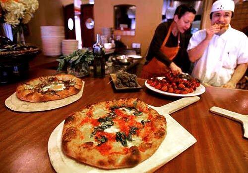 Nancy Silverton, left, and executive chef Matt Molina make pizzas and more at Mozza. Silverton opened the pizzeria with Mario Batali.