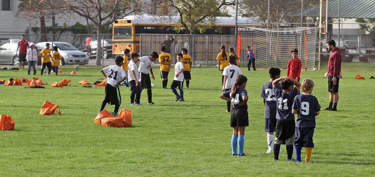 Teams with One Glendale warm up for a soccer game at Pacific Park, where teams from Glendale Unified prepare and compete on Wednesday, March 2, 2016. This is the first year for the One Glendale program which started in the fall with flag football, then basketball, and now soccer.