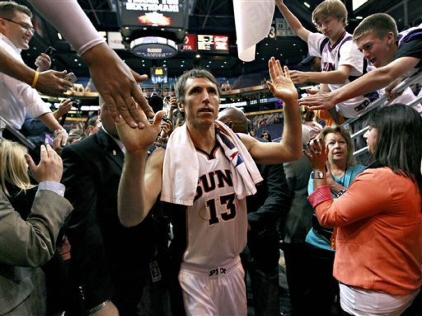 FILE - In this April 25, 2012, file photo, Phoenix Suns' Steve Nash leaves the court after an NBA basketball game against the San Antonio Spurs in Phoenix. Nash's agent Bill Duffy said Wednesday, July 4, that the two-time MVP point guard is going to the Los Angeles Lakers in a sign-and-trade deal with the Phoenix Suns. (AP Photo/Matt York, File)
