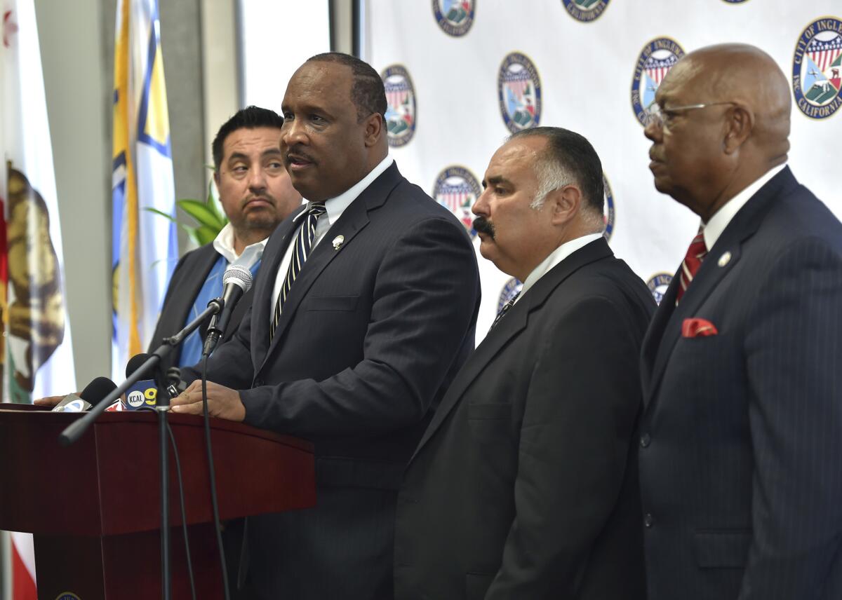 Inglewood Mayor James Butts Jr. is flanked by councilmen, from left, Eloy Morales, Alex Padilla and George Dotson during news conference Thursday June 15, 2017 in Inglewood, Calif. The Inglewood City Council unanimously approved an exclusive negotiating agreement with the Los Angeles Clippers on Thursday that could lead to the construction of an arena for the NBA team across the street from the future home of the NFL's Chargers and Rams. (Robert Casillas/Los Angeles Daily News via AP)
