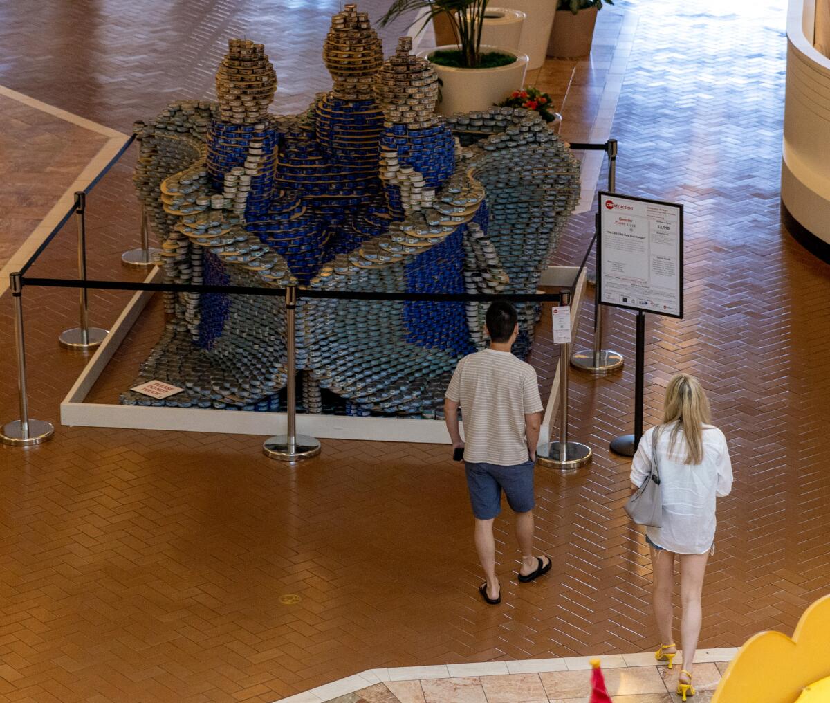 Gensler+Clune+Taber's sculpture "We CAN CAN Help End Hunger" is composed of 13,100 tuna cans.