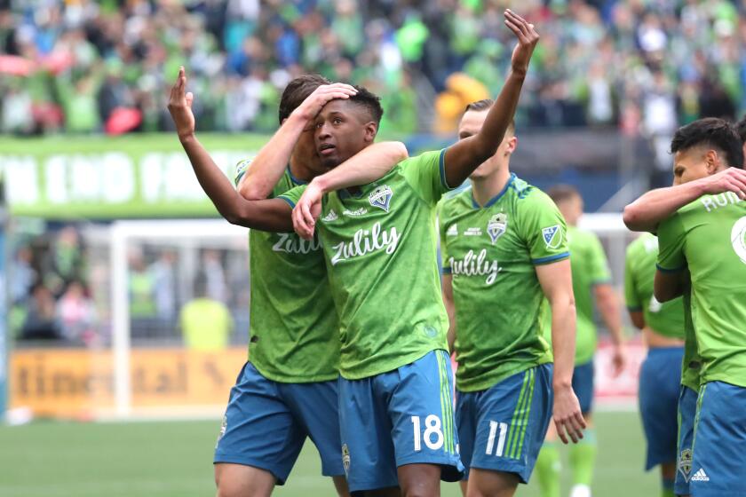 SEATTLE, WASHINGTON - NOVEMBER 10: Kelvin Leerdam #18 of the Seattle Sounders celebrates with teammates after scoring a goal to take a 1-0 lead against Toronto FC in the second half during the 2019 MLS Cup at CenturyLink Field on November 10, 2019 in Seattle, Washington. (Photo by Abbie Parr/Getty Images)