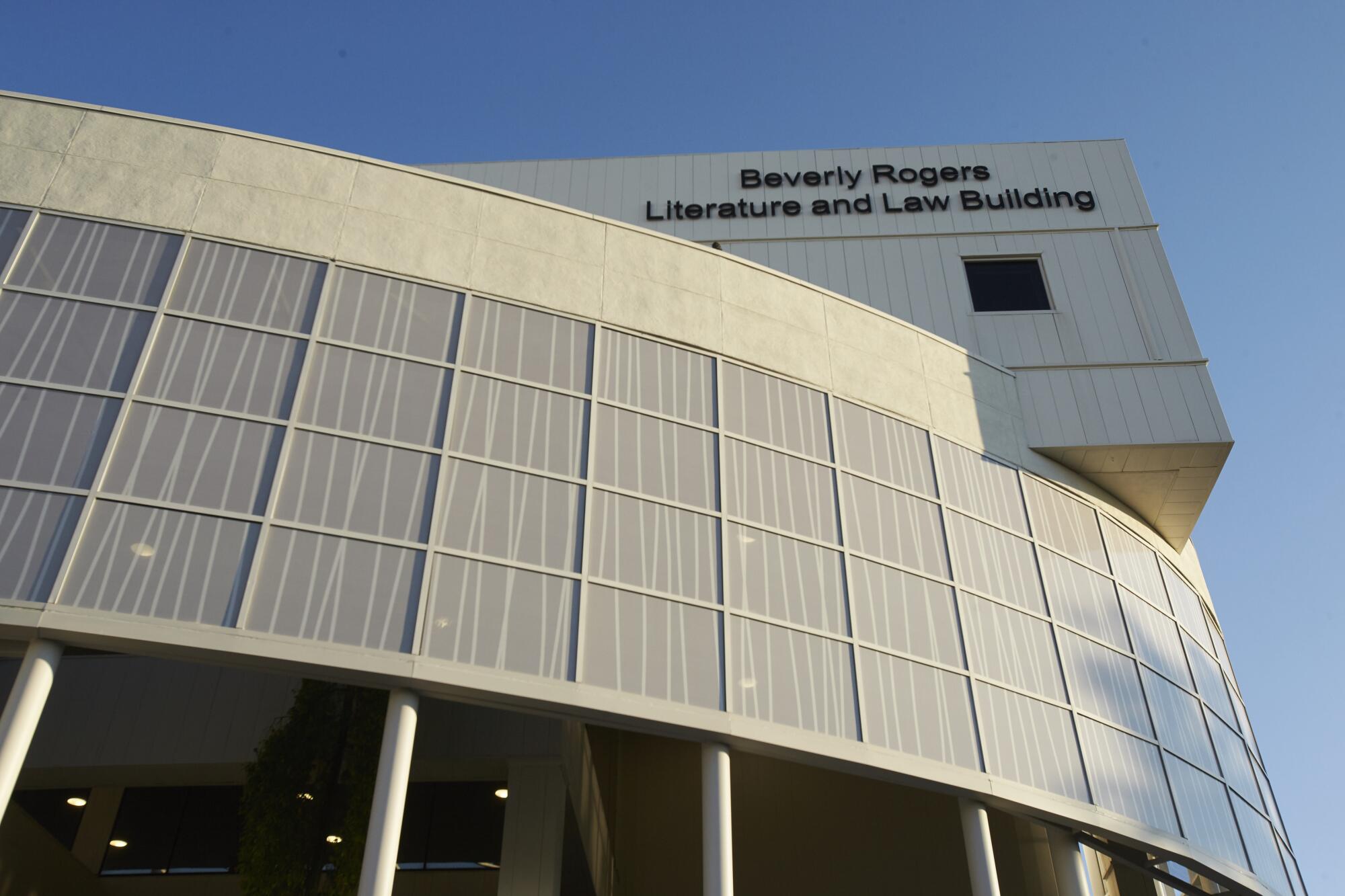 A building with the words "Beverly Rogers Literature and Law Building" on it