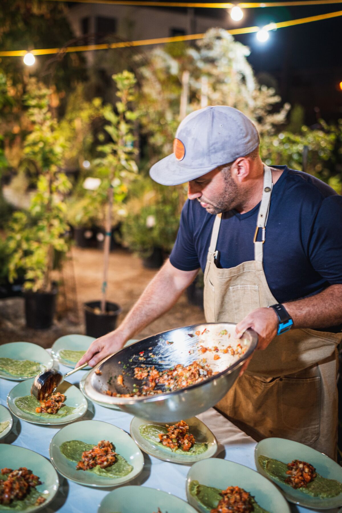 Chef Fred Keller prepares a meal for The Blank Table dinner series, which he cofounded in 2019 with partner Alexandria Ott.