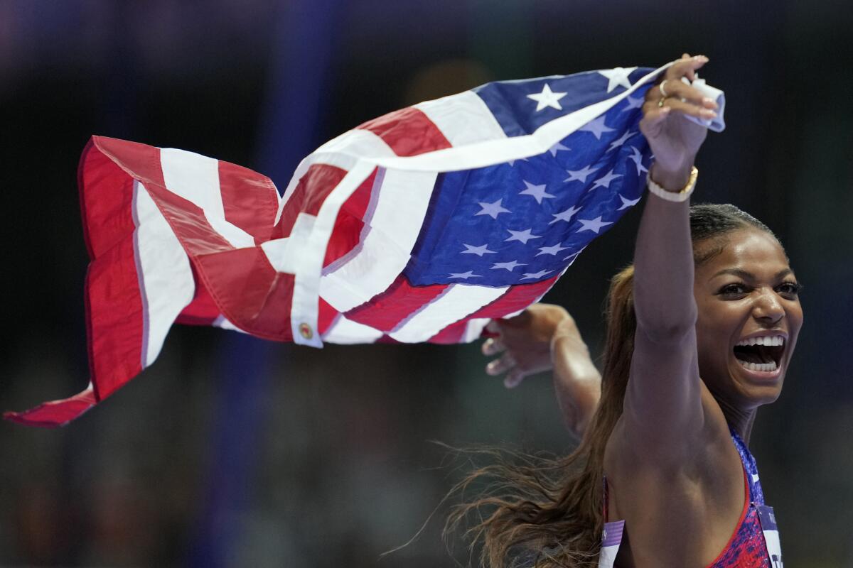 American Gabby Thomas celebrates winning the gold medal in the women's 200 meters final at the 2024 Summer Olympics