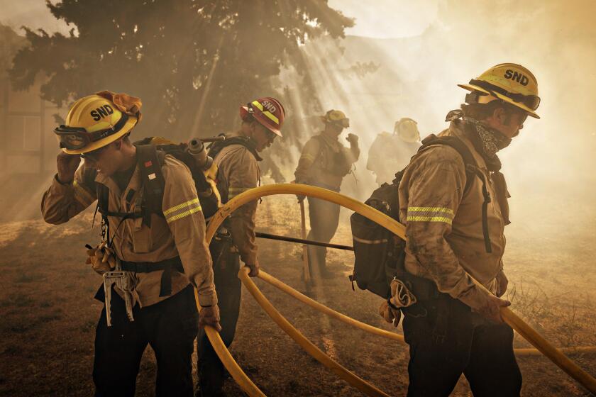Gorman, CA - June 16: On Orwin road fire crews battle a hot spot at the Gorman Brush Fire in northern Los Angeles County on Sunday, June 16, 2024 in Gorman, CA. (Jason Armond / Los Angeles Times)