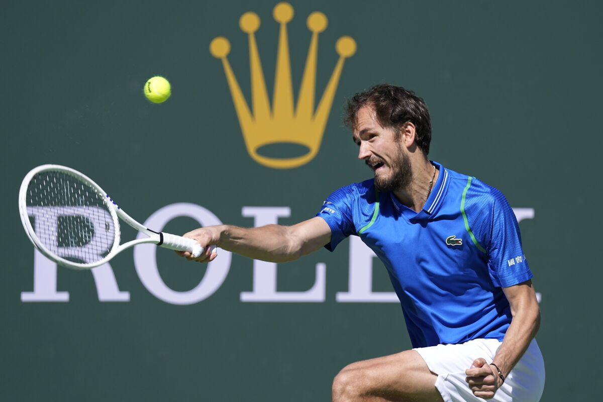 Daniil Medvedev hits a return during his win over Frances Tiafoe at the BNP Paribas Open on Saturday.