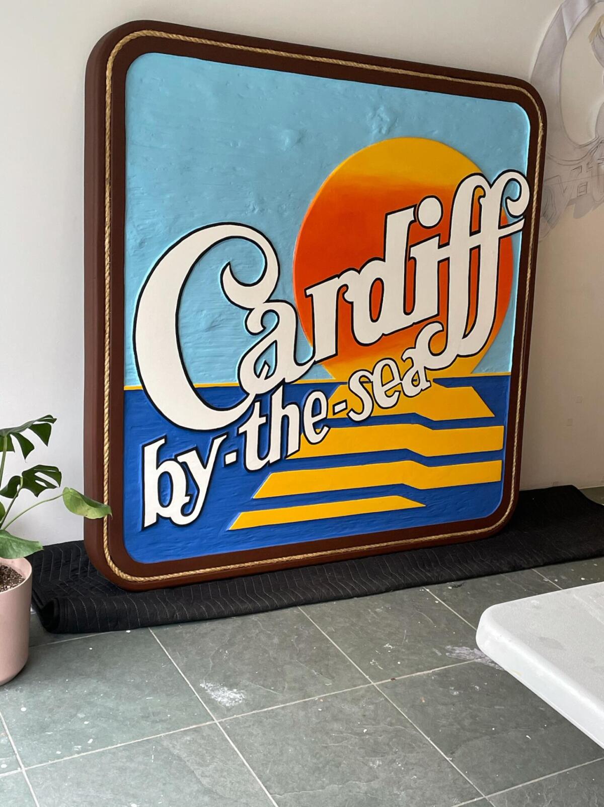 The large, wooden “Cardiff-by-the-Sea” sign