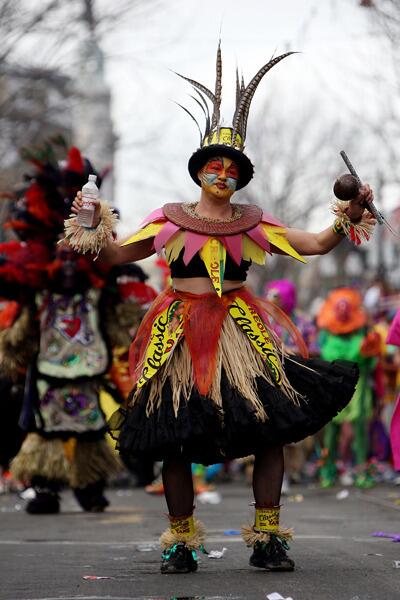 A reveler dances in the Krewe of Mondo Kayo on Mardi Gras.