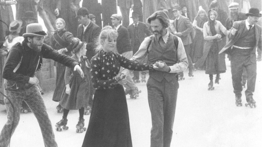 James Averill (Kris Kistofferson) roller skates with Ella Watson (Isabelle Huppert) at the Heaven's Gate roller rink, an amusement arena frequented by newly arrived settlers in Michael Cimino's 'Heaven's Gate.'