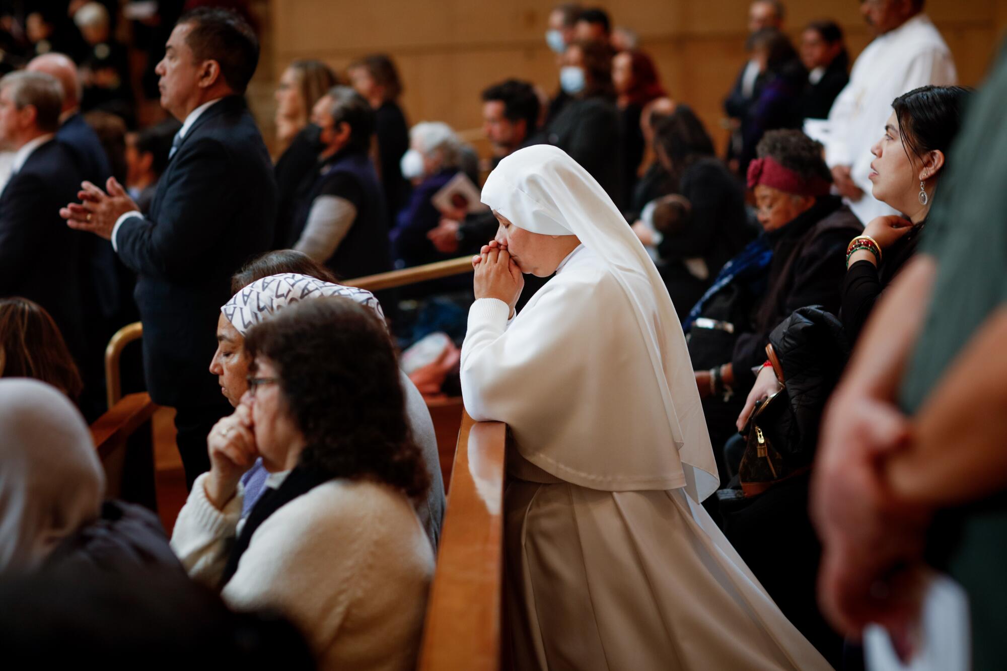 Margarita Rico, a nun with the Servants of Mary, prays.
