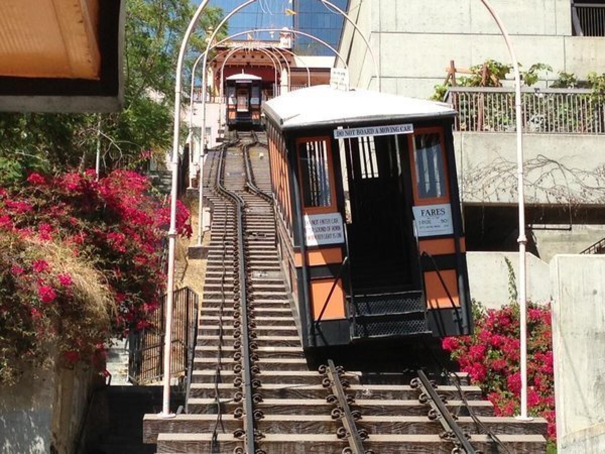 One of the Angels Flight funicular railway cars derailed Thursday and was left tilting on the rail platform.