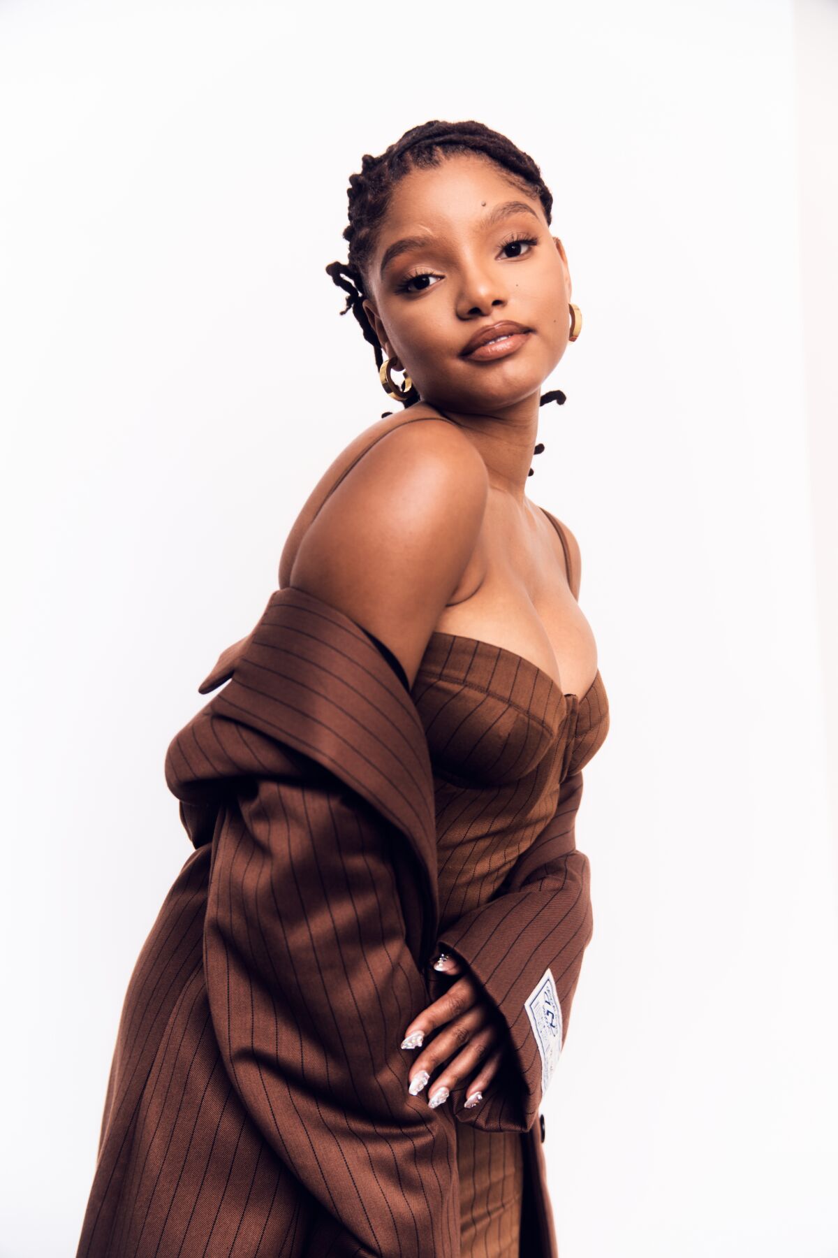 Halle Bailey posing for a portrait