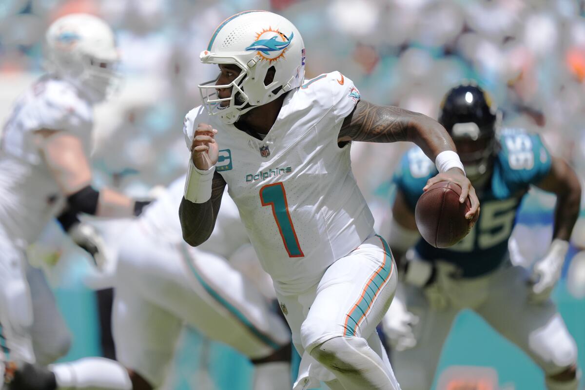  Dolphins quarterback Tua Tagovailoa (1) runs against the Jaguars in Week 1.