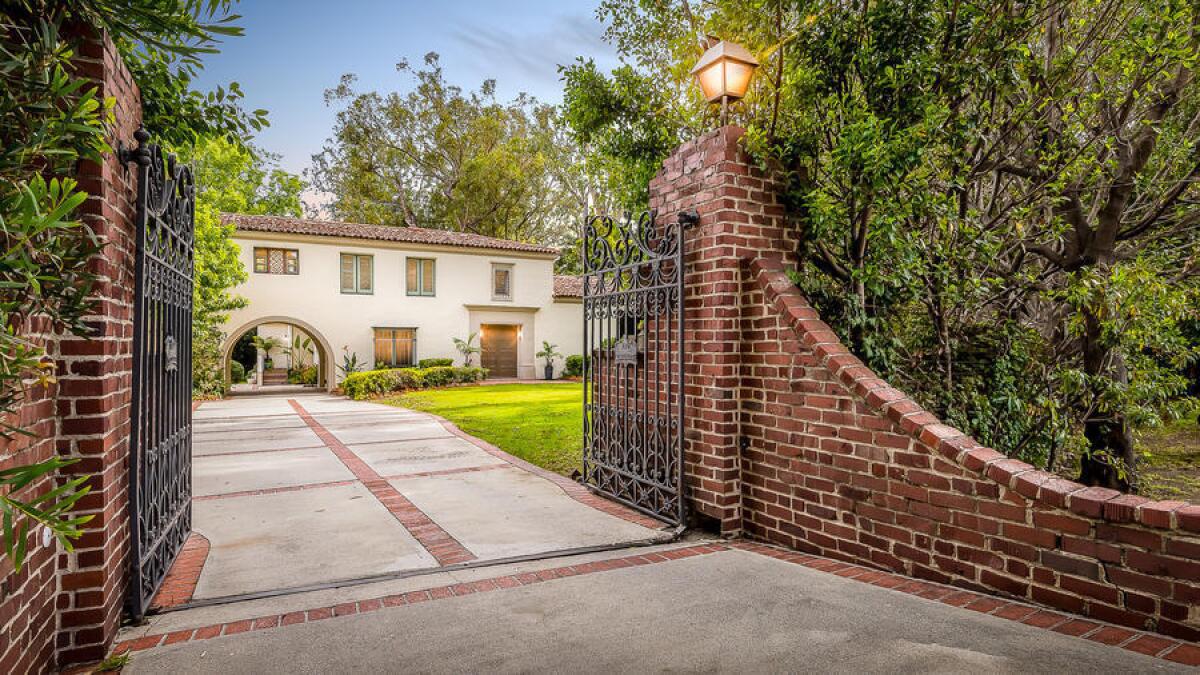 The 1920s Spanish Revival-style home sits on about an acre in the Brentwood Park are