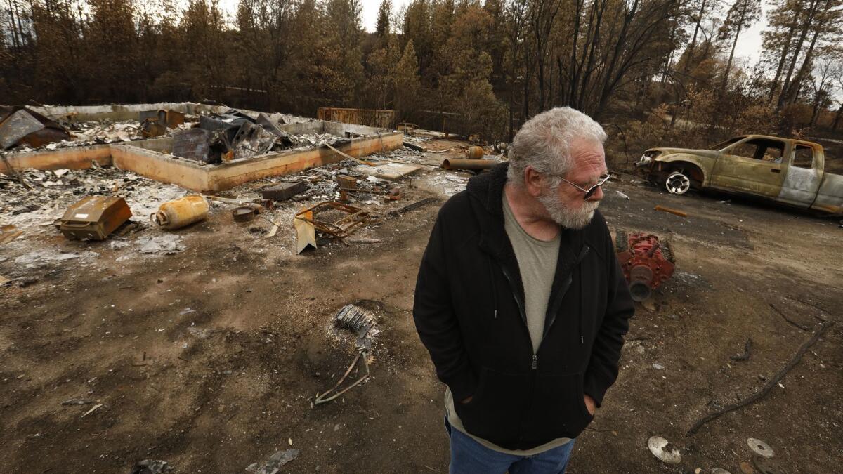 Daniel Andrus, 66, visits his property in Concow for the first time. This is the second time he has lost everything in a fire, the last time was in 2008. He says he will rebuild because he has no other place to go and he owns his property.