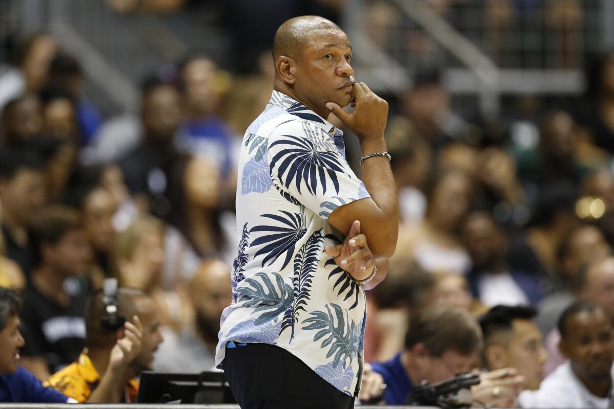 Clippers coach Doc Rivers, watching his team play in its preseason opener Thursday.