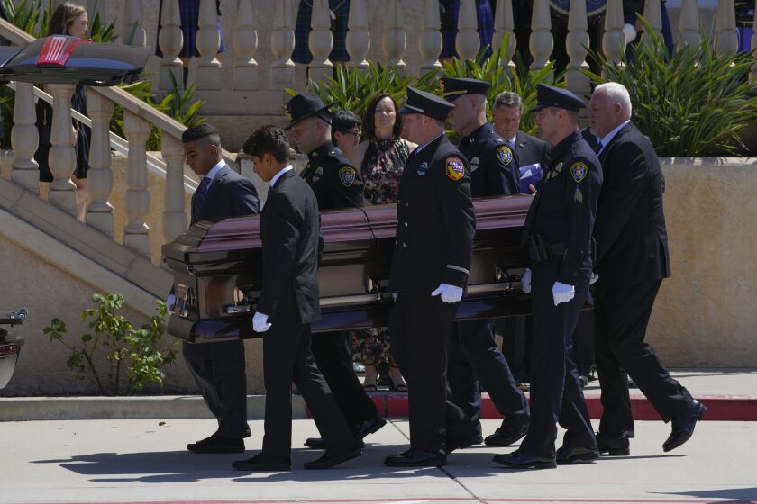 El Cajon, CA - August 11: On Wednesday, Aug. 11, 2021 at Shadow Mountain Community Church in El Cajon, CA., pallbearers carry the coffin from the church to the funeral Hearst. Memorial service for Daniel Gene Walters was held at Shadow Mountain Church, where dozens of officers attended including David Nisleit, San Diego Police Chief. (Nelvin C. Cepeda / The San Diego Union-Tribune)