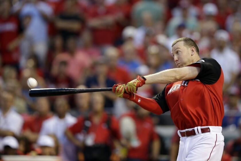 Reds third baseman Todd Frazier connects during the home run derby. Frazier beat Dodgers outfielder Joc Pederson for the title.