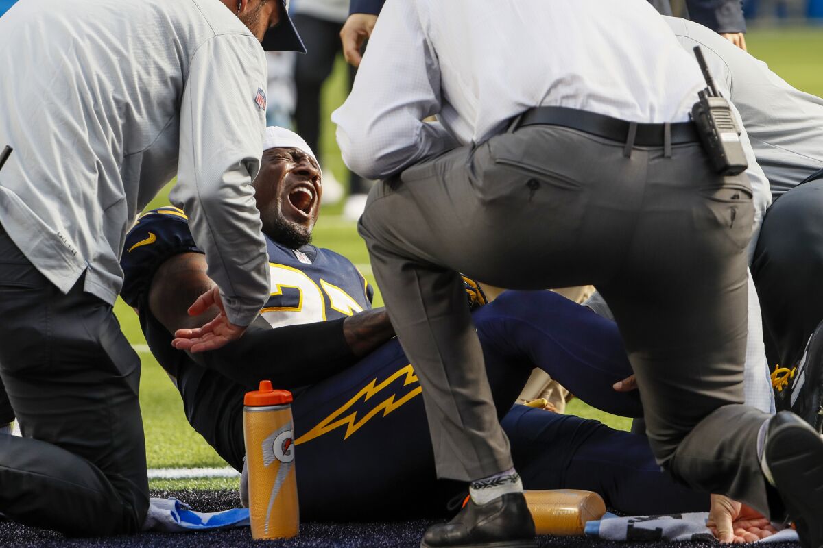  Chargers cornerback J.C. Jackson (27) screams after suffering an apparent knee injury in a game against Seattle.