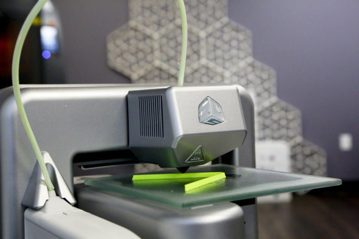 A 3-D printer replicates a plastic form at a 3D Systems Inc. lab in Valencia.