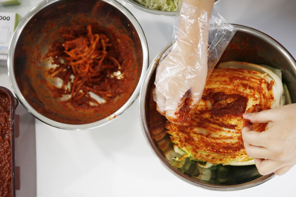 Jessie Kim teaches how to make kimchi, North Korean style, during a cooking class in Seoul.