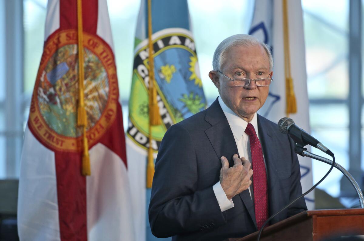 U.S. Attorney General Jeff Sessions gestures as he speaks during a news conference on Aug. 16, 2017, at PortMiami. Sessions visited Miami to hail it as an example of a place that reversed its sanctuary policies to follow President Donald Trump's orders.